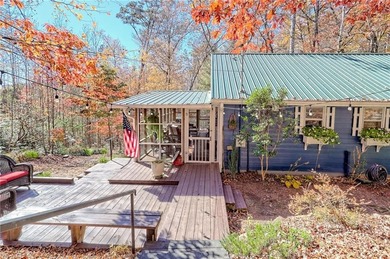 Charming Lake Burton Cottage with Deeded Lake Access - Under on Waterfall Country Club in Georgia - for sale on GolfHomes.com, golf home, golf lot