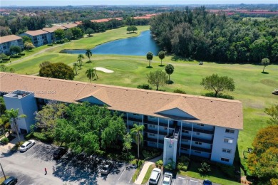 Enjoy beautiful golf course views from the large screened porch on Flamingo Lakes Country Club in Florida - for sale on GolfHomes.com, golf home, golf lot