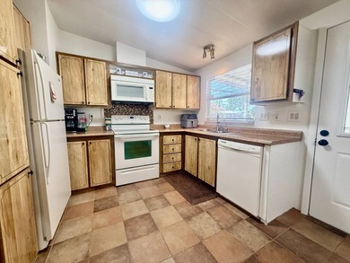 Home is located in Water Oak Country Club Estates in Lady Lake on Water Oak Country Club Estates in Florida - for sale on GolfHomes.com, golf home, golf lot