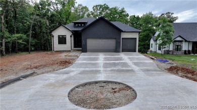 Stunning New Construction  Reverse 1.5 Story  Modern Farmhouse on The Club At Porto Cima in Missouri - for sale on GolfHomes.com, golf home, golf lot
