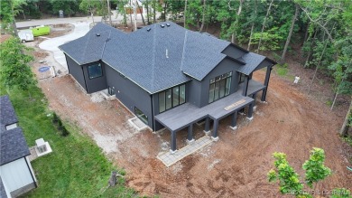 Stunning New Construction  Reverse 1.5 Story  Modern Farmhouse on The Club At Porto Cima in Missouri - for sale on GolfHomes.com, golf home, golf lot