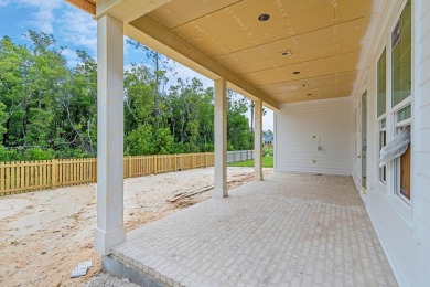 With the newly extended front porch, this enhanced Brady has all on Origins Golf Club in Florida - for sale on GolfHomes.com, golf home, golf lot