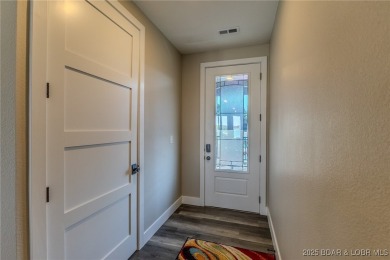 This newly constructed condo at Mile Marker 13 is an ideal on Seasons Ridge At Four Seasons in Missouri - for sale on GolfHomes.com, golf home, golf lot