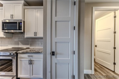 This newly constructed condo at Mile Marker 13 is an ideal on Seasons Ridge At Four Seasons in Missouri - for sale on GolfHomes.com, golf home, golf lot