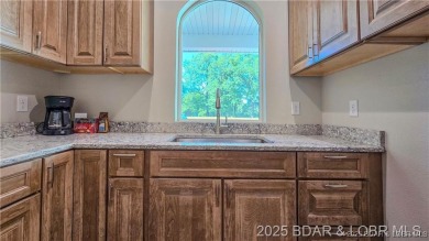 Step into the epitome of luxurious living at The Estates of on The Club At Old Kinderhook in Missouri - for sale on GolfHomes.com, golf home, golf lot