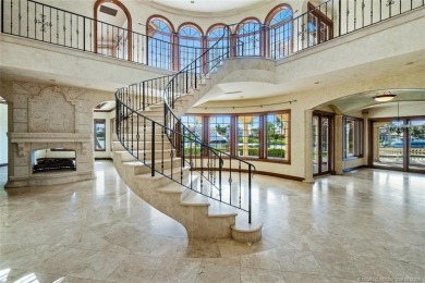 This 8,000-sq.-ft. Mediterranean masterpiece in exclusive on Sailfish Point Golf Club, Inc. in Florida - for sale on GolfHomes.com, golf home, golf lot