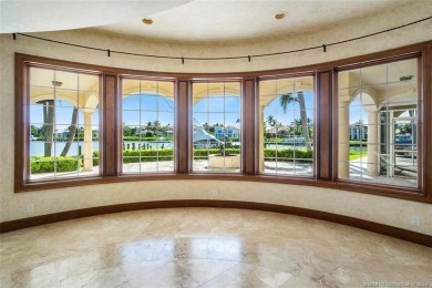 This 8,000-sq.-ft. Mediterranean masterpiece in exclusive on Sailfish Point Golf Club, Inc. in Florida - for sale on GolfHomes.com, golf home, golf lot