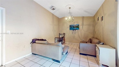 This home features a spacious layout with tile flooring on Palmetto Golf Course in Florida - for sale on GolfHomes.com, golf home, golf lot