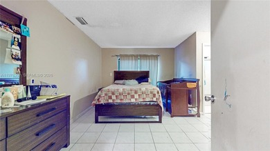 This home features a spacious layout with tile flooring on Palmetto Golf Course in Florida - for sale on GolfHomes.com, golf home, golf lot