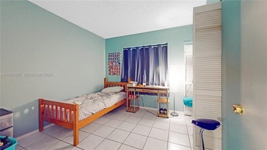 This home features a spacious layout with tile flooring on Palmetto Golf Course in Florida - for sale on GolfHomes.com, golf home, golf lot