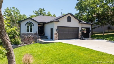 Immaculate Four Seasons home situated on an interior lake! This on Seasons Ridge At Four Seasons in Missouri - for sale on GolfHomes.com, golf home, golf lot