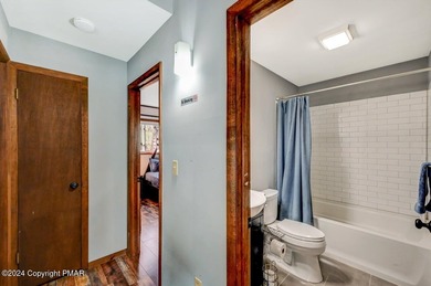 This Timber Trails three-generation family home in Lake Naomi on Lake Naomi Timber Trails Golf Club in Pennsylvania - for sale on GolfHomes.com, golf home, golf lot