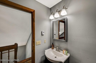 This Timber Trails three-generation family home in Lake Naomi on Lake Naomi Timber Trails Golf Club in Pennsylvania - for sale on GolfHomes.com, golf home, golf lot