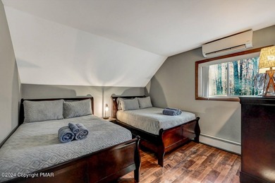 This Timber Trails three-generation family home in Lake Naomi on Lake Naomi Timber Trails Golf Club in Pennsylvania - for sale on GolfHomes.com, golf home, golf lot