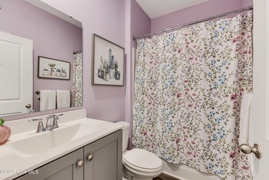 Coastal style meets everyday ease at 1728 Culdees Lane in Avalon on Lennon Hills Golf Course in North Carolina - for sale on GolfHomes.com, golf home, golf lot