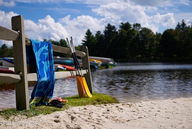 This Timber Trails three-generation family home in Lake Naomi on Lake Naomi Timber Trails Golf Club in Pennsylvania - for sale on GolfHomes.com, golf home, golf lot