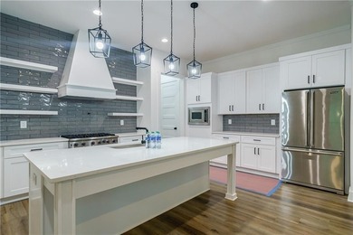 PRICE IMPROVEMENT! RELOCATION! MOVE-IN READY! THOUSANDS OF on Traditions of Braselton Golf Club in Georgia - for sale on GolfHomes.com, golf home, golf lot