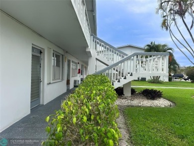 Bright  Spacious First-Floor Corner Unit! This 2-bedroom, 1 on Hillsboro Pines Golf in Florida - for sale on GolfHomes.com, golf home, golf lot