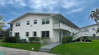 Bright  Spacious First-Floor Corner Unit! This 2-bedroom, 1 on Hillsboro Pines Golf in Florida - for sale on GolfHomes.com, golf home, golf lot