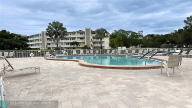 Bright  Spacious First-Floor Corner Unit! This 2-bedroom, 1 on Hillsboro Pines Golf in Florida - for sale on GolfHomes.com, golf home, golf lot