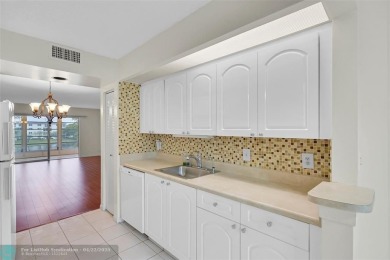 This 'JUNIPER' FLOOR PLAN HAS INSIDE WASHER/DRYER, UPDATED on Wynmoor Golf Course in Florida - for sale on GolfHomes.com, golf home, golf lot