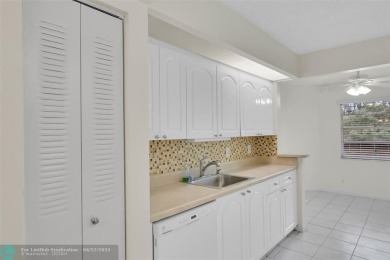 This 'JUNIPER' FLOOR PLAN HAS INSIDE WASHER/DRYER, UPDATED on Wynmoor Golf Course in Florida - for sale on GolfHomes.com, golf home, golf lot