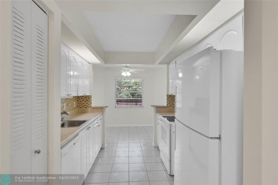 This 'JUNIPER' FLOOR PLAN HAS INSIDE WASHER/DRYER, UPDATED on Wynmoor Golf Course in Florida - for sale on GolfHomes.com, golf home, golf lot