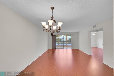 This 'JUNIPER' FLOOR PLAN HAS INSIDE WASHER/DRYER, UPDATED on Wynmoor Golf Course in Florida - for sale on GolfHomes.com, golf home, golf lot