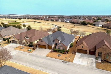 Experience golf course living at its finest in this beautifully on Wildhorse Golf Club of Robson Ranch in Texas - for sale on GolfHomes.com, golf home, golf lot