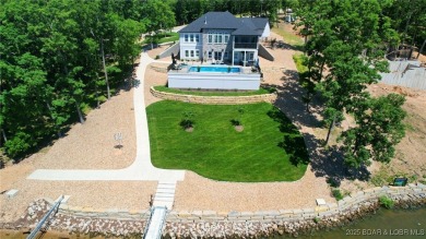 Introducing East Villages! An exquisite lakefront property on The Club At Porto Cima in Missouri - for sale on GolfHomes.com, golf home, golf lot