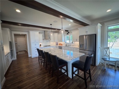 Introducing East Villages! An exquisite lakefront property on The Club At Porto Cima in Missouri - for sale on GolfHomes.com, golf home, golf lot