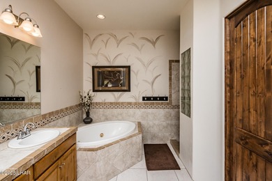 Take a look at this stunning RV garage home located in a private on London Bridge Golf Course in Arizona - for sale on GolfHomes.com, golf home, golf lot