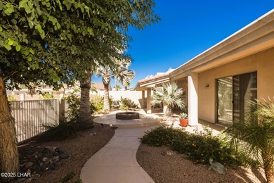 Take a look at this stunning RV garage home located in a private on London Bridge Golf Course in Arizona - for sale on GolfHomes.com, golf home, golf lot