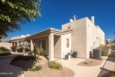 Take a look at this stunning RV garage home located in a private on London Bridge Golf Course in Arizona - for sale on GolfHomes.com, golf home, golf lot