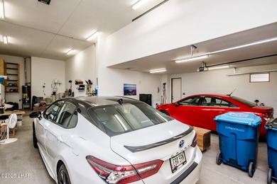 Take a look at this stunning RV garage home located in a private on London Bridge Golf Course in Arizona - for sale on GolfHomes.com, golf home, golf lot