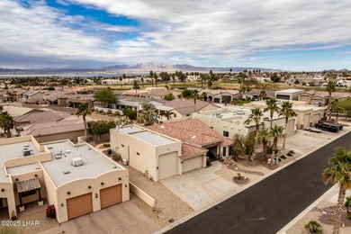 Take a look at this stunning RV garage home located in a private on London Bridge Golf Course in Arizona - for sale on GolfHomes.com, golf home, golf lot