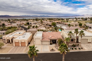 Take a look at this stunning RV garage home located in a private on London Bridge Golf Course in Arizona - for sale on GolfHomes.com, golf home, golf lot