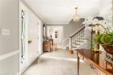 Situated on the 14th green of the newly renovated Forest Oaks on Forest Oaks Country Club in North Carolina - for sale on GolfHomes.com, golf home, golf lot