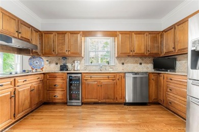 Situated on the 14th green of the newly renovated Forest Oaks on Forest Oaks Country Club in North Carolina - for sale on GolfHomes.com, golf home, golf lot