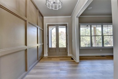 Step into refined luxury at 2881 Traditions Way in the on Traditions of Braselton Golf Club in Georgia - for sale on GolfHomes.com, golf home, golf lot