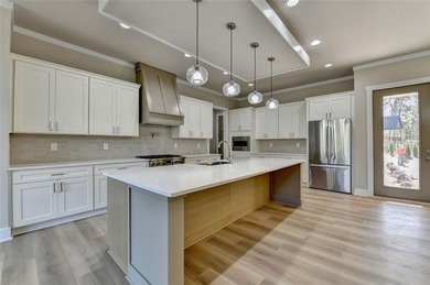 Step into refined luxury at 2881 Traditions Way in the on Traditions of Braselton Golf Club in Georgia - for sale on GolfHomes.com, golf home, golf lot