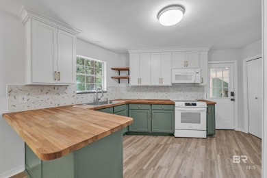 Experience exceptional Creekside living with this 4-bedroom, 2 on Lake Forest Yacht and Country Club in Alabama - for sale on GolfHomes.com, golf home, golf lot