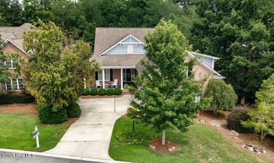 Enjoy the country club lifestyle, tree lined streets and on Porters Neck Country Club in North Carolina - for sale on GolfHomes.com, golf home, golf lot