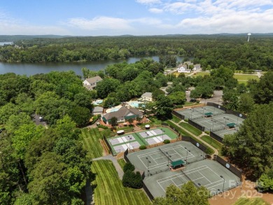 Experience refined living in this exquisite estate nestled on Old North State Club at Uwharrie Point Golf community in North Carolina - for sale on GolfHomes.com, golf home, golf lot