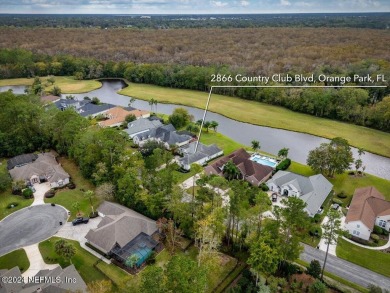 Discover luxury living in the prestigious, guard-gated Country on Country Club of Orange Park in Florida - for sale on GolfHomes.com, golf home, golf lot