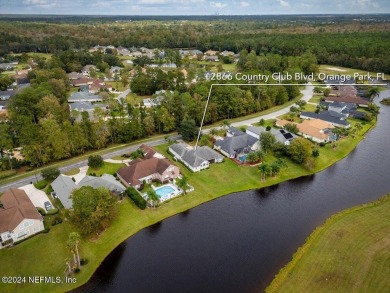 Discover luxury living in the prestigious, guard-gated Country on Country Club of Orange Park in Florida - for sale on GolfHomes.com, golf home, golf lot