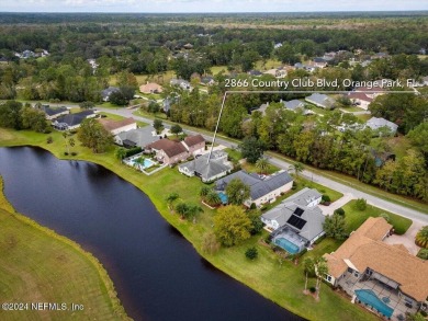 Discover luxury living in the prestigious, guard-gated Country on Country Club of Orange Park in Florida - for sale on GolfHomes.com, golf home, golf lot