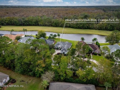 Discover luxury living in the prestigious, guard-gated Country on Country Club of Orange Park in Florida - for sale on GolfHomes.com, golf home, golf lot