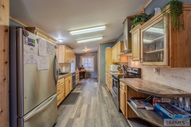 Location, location, location! Just 20 minutes from Yellowstone on Island Park Village Resort Golf Course in Idaho - for sale on GolfHomes.com, golf home, golf lot