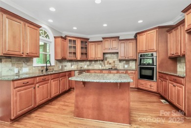 Welcome to 10817 Emerald Wood Drive! This elegant brick home in on Skybrook Golf Club in North Carolina - for sale on GolfHomes.com, golf home, golf lot